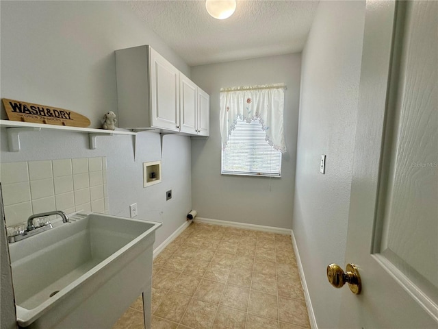 2820 Pankaw Ln, Valrico, FL 33596 - laundry area with hookup for a washing machine, hookup for an electric dryer, a textured ceiling, cabinet space, and baseboards