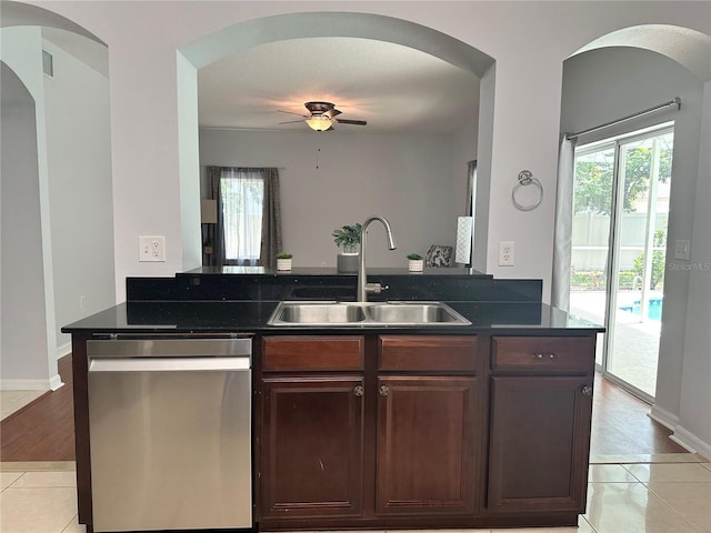 2820 Pankaw Ln, Valrico, FL 33596 - kitchen featuring dishwasher, a sink, arched walkways, light tile patterned flooring, and a ceiling fan