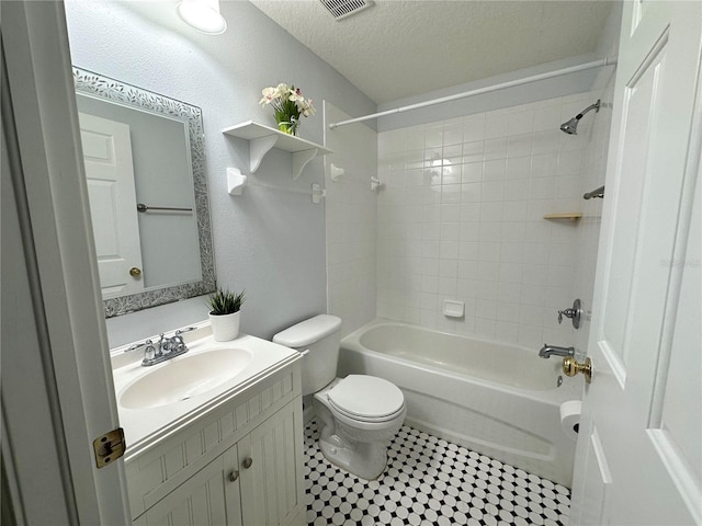 2820 Pankaw Ln, Valrico, FL 33596 - bathroom with toilet, tub / shower combination, a textured ceiling, vanity, and tile patterned flooring