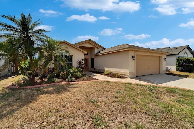1601 Westerly Dr, Brandon, FL 33511 - view of front of home with concrete driveway, a garage, a front lawn, and stucco siding