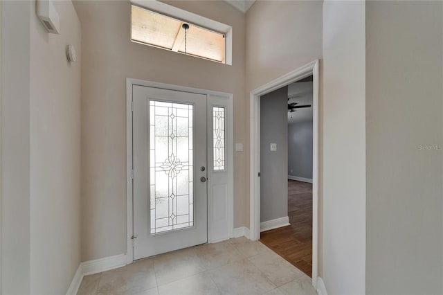 1601 Westerly Dr, Brandon, FL 33511 - foyer entrance with baseboards, a high ceiling, and light tile patterned flooring