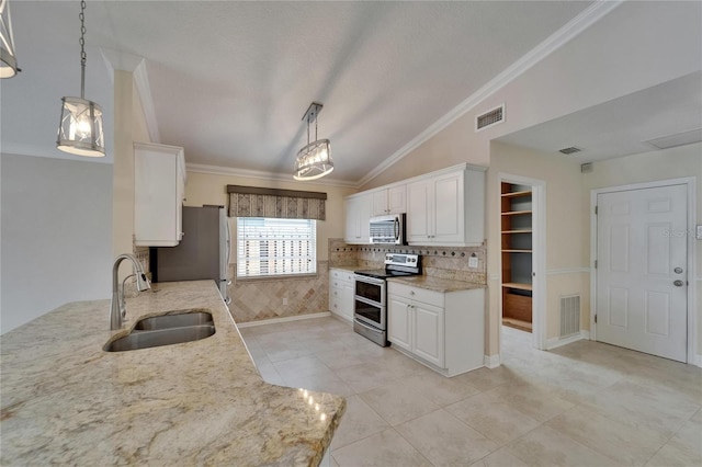 1601 Westerly Dr, Brandon, FL 33511 - kitchen featuring a sink, stainless steel appliances, lofted ceiling, and visible vents