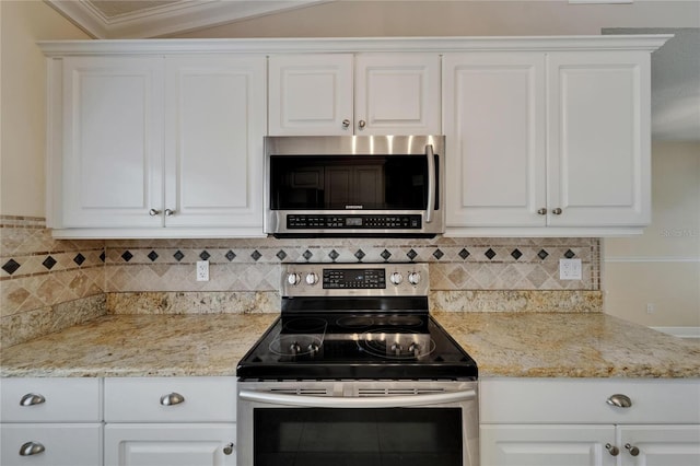 1601 Westerly Dr, Brandon, FL 33511 - kitchen featuring light stone counters, tasteful backsplash, stainless steel appliances, and white cabinetry