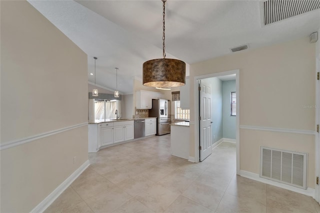 1601 Westerly Dr, Brandon, FL 33511 - kitchen featuring stainless steel appliances, visible vents, and white cabinetry