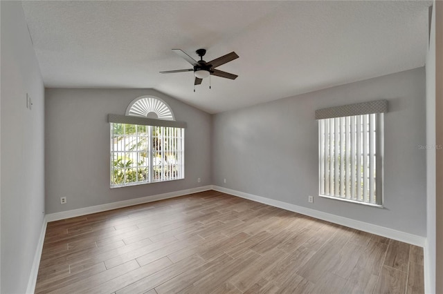 1601 Westerly Dr, Brandon, FL 33511 - spare room with vaulted ceiling, baseboards, a ceiling fan, and wood finished floors