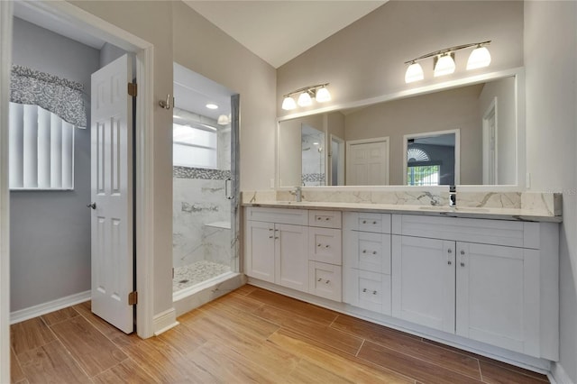 1601 Westerly Dr, Brandon, FL 33511 - full bath with a sink, double vanity, a marble finish shower, baseboards, and wood finished floors