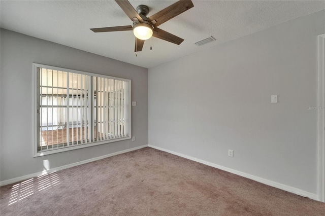 1601 Westerly Dr, Brandon, FL 33511 - carpeted spare room with visible vents, a textured ceiling, baseboards, and ceiling fan