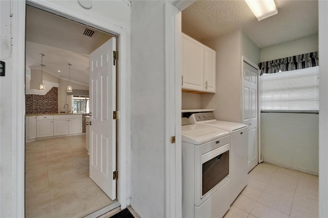 1601 Westerly Dr, Brandon, FL 33511 - washroom with cabinet space, independent washer and dryer, a sink, light tile patterned floors, and visible vents