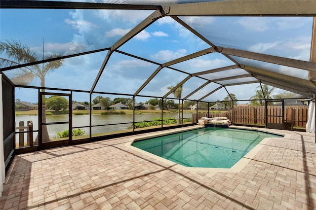 1601 Westerly Dr, Brandon, FL 33511 - outdoor pool featuring a water view, an in ground hot tub, a lanai, and a patio