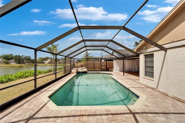 1601 Westerly Dr, Brandon, FL 33511 - outdoor pool with fence, a patio, a water view, and a lanai