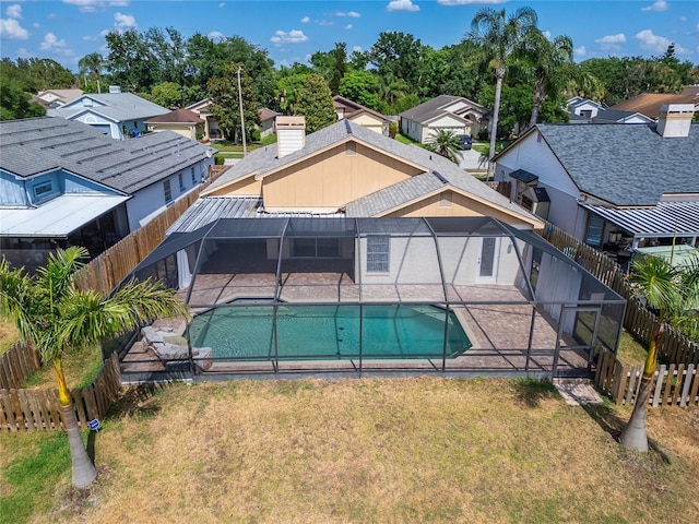 1601 Westerly Dr, Brandon, FL 33511 - view of swimming pool with glass enclosure, a patio, a fenced in pool, and a fenced backyard