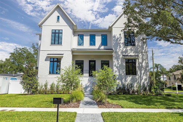 2218 S Occident St, Tampa, FL 33629 - modern inspired farmhouse with a front lawn, a standing seam roof, and metal roof