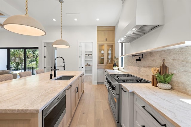 2218 S Occident St, Tampa, FL 33629 - kitchen with wall chimney exhaust hood, a sink, stainless steel appliances, recessed lighting, and light wood-style flooring