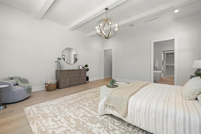 2218 S Occident St, Tampa, FL 33629 - bedroom with an inviting chandelier, baseboards, beamed ceiling, and light wood finished floors