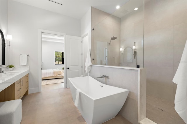 2218 S Occident St, Tampa, FL 33629 - ensuite bathroom with a freestanding tub, a walk in shower, vanity, connected bathroom, and recessed lighting