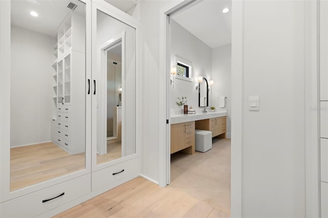 2218 S Occident St, Tampa, FL 33629 - bathroom with visible vents, recessed lighting, wood finished floors, and vanity