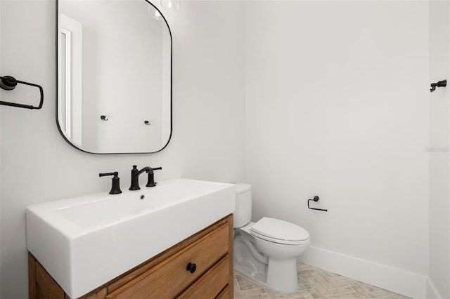 2218 S Occident St, Tampa, FL 33629 - bathroom featuring toilet, baseboards, and vanity