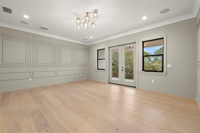 2218 S Occident St, Tampa, FL 33629 - empty room featuring baseboards, french doors, light wood-style flooring, and visible vents