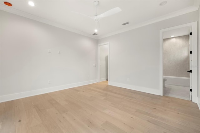 2218 S Occident St, Tampa, FL 33629 - spare room with crown molding, light wood-style flooring, baseboards, and visible vents