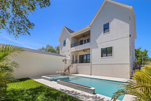 2218 S Occident St, Tampa, FL 33629 - back of house with stairs, ceiling fan, stucco siding, and a pool with connected hot tub