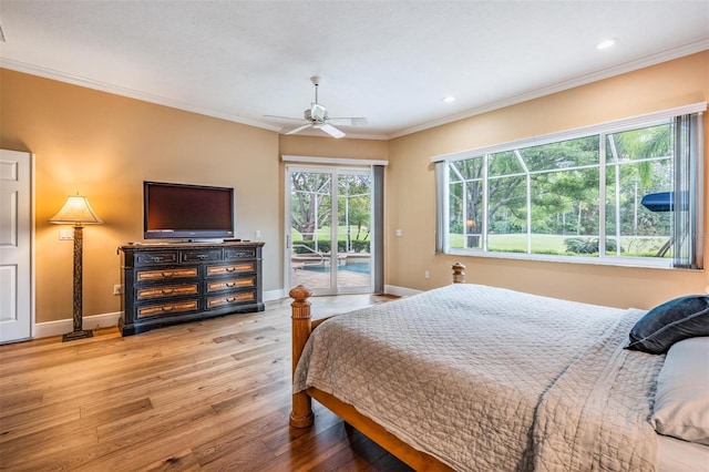 bedroom featuring baseboards, wood-type flooring, crown molding, and access to exterior