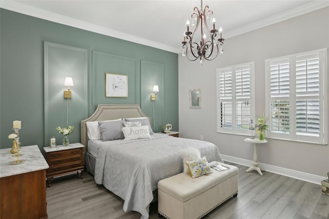 21746 Amelia Rose Way, Land O Lakes, FL 34637 - bedroom with crown molding, baseboards, an inviting chandelier, and wood finished floors