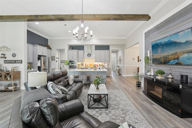21746 Amelia Rose Way, Land O Lakes, FL 34637 - living area featuring crown molding, an inviting chandelier, beam ceiling, light wood-style floors, and recessed lighting
