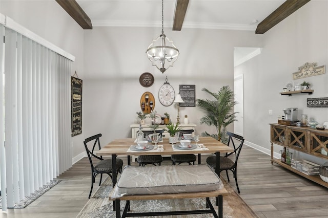 21746 Amelia Rose Way, Land O Lakes, FL 34637 - dining area featuring crown molding, beamed ceiling, baseboards, a chandelier, and light wood finished floors