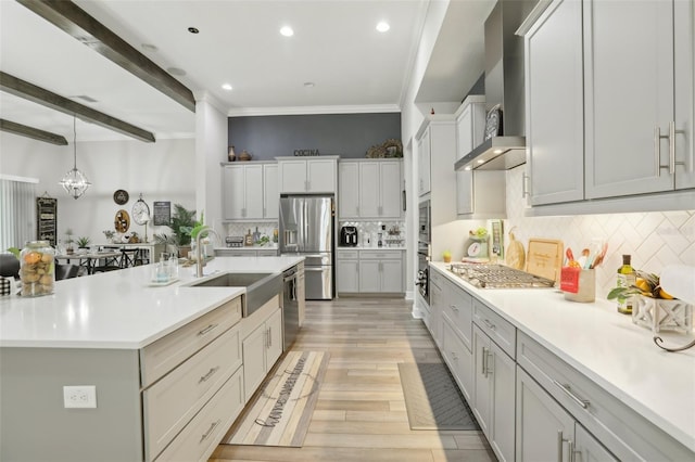 21746 Amelia Rose Way, Land O Lakes, FL 34637 - kitchen with crown molding, light countertops, tasteful backsplash, a sink, and stainless steel appliances