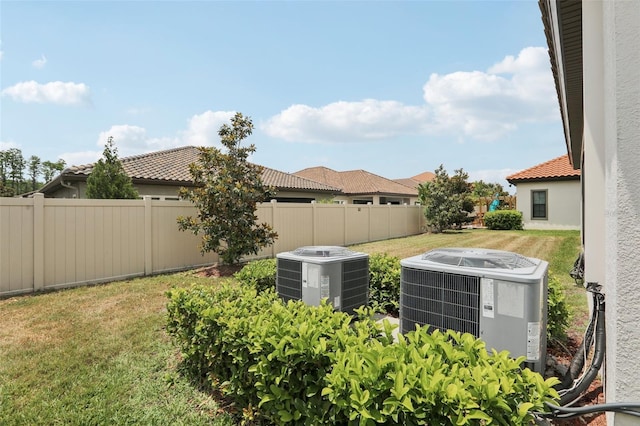 21746 Amelia Rose Way, Land O Lakes, FL 34637 - view of yard featuring fence and central AC