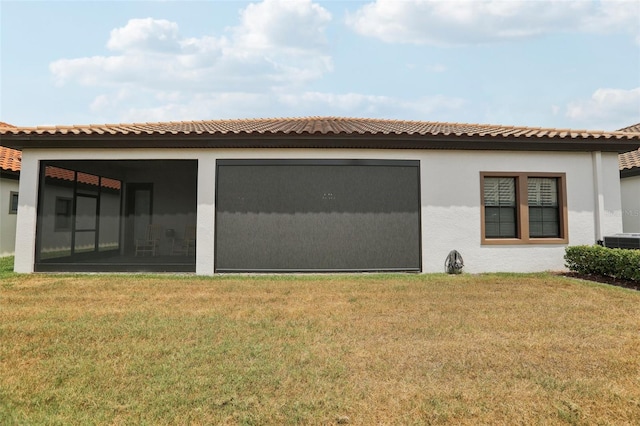 21746 Amelia Rose Way, Land O Lakes, FL 34637 - back of house featuring a yard, cooling unit, a sunroom, and stucco siding