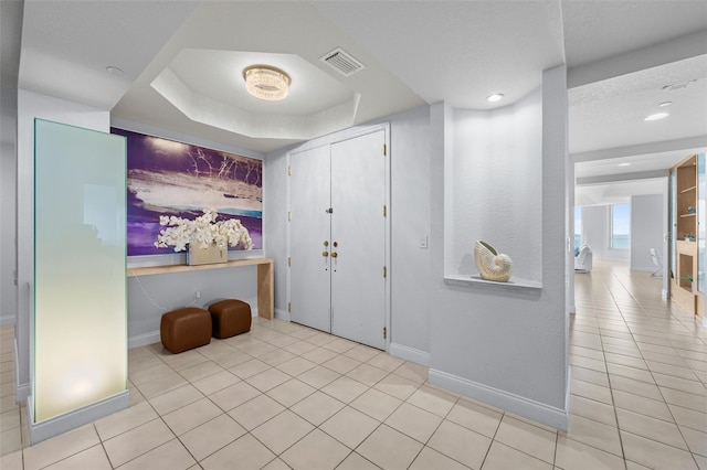 1170 Gulf Blvd Unit 2101, Clearwater Beach, FL 33767 - foyer with tile patterned floors, baseboards, recessed lighting, and a tray ceiling