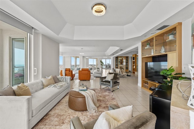 1170 Gulf Blvd Unit 2101, Clearwater Beach, FL 33767 - living room with a raised ceiling and light tile patterned floors