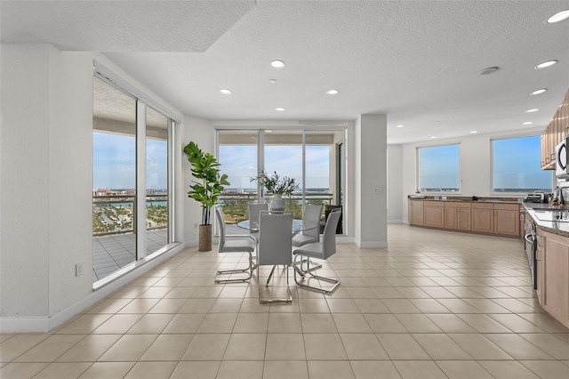 1170 Gulf Blvd Unit 2101, Clearwater Beach, FL 33767 - dining space with recessed lighting, a textured ceiling, baseboards, and light tile patterned flooring