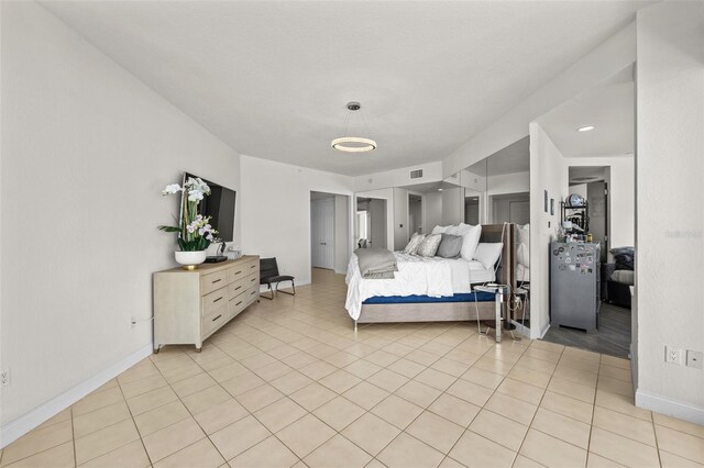 1170 Gulf Blvd Unit 2101, Clearwater Beach, FL 33767 - bedroom with baseboards and light tile patterned floors