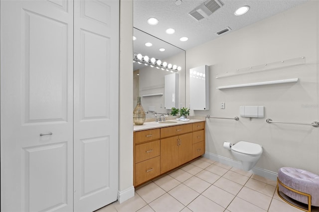1170 Gulf Blvd Unit 2101, Clearwater Beach, FL 33767 - full bathroom featuring baseboards, toilet, a textured ceiling, tile patterned floors, and vanity