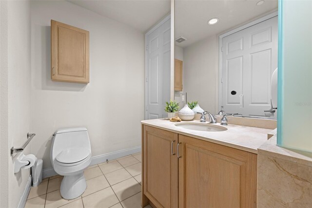 1170 Gulf Blvd Unit 2101, Clearwater Beach, FL 33767 - bathroom with toilet, baseboards, tile patterned flooring, vanity, and recessed lighting