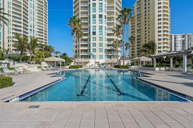1170 Gulf Blvd Unit 2101, Clearwater Beach, FL 33767 - community pool featuring a patio area and a pergola