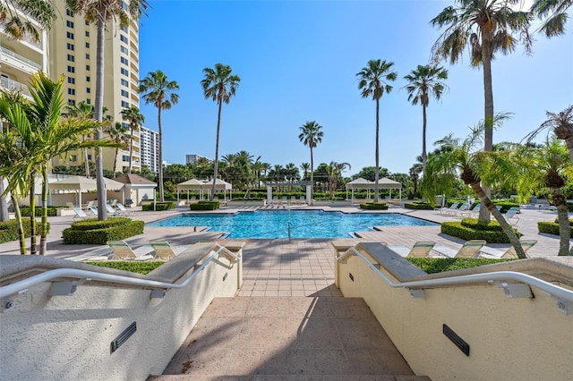 1170 Gulf Blvd Unit 2101, Clearwater Beach, FL 33767 - community pool featuring a gazebo and a patio