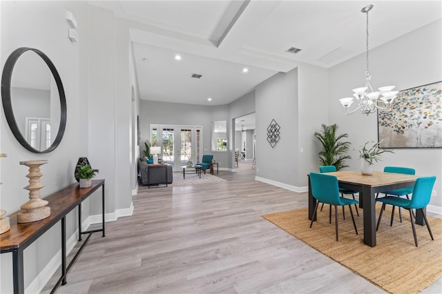 10517 Palm Cove Ave, Tampa, FL 33647 - dining area with visible vents, light wood-type flooring, baseboards, an inviting chandelier, and recessed lighting