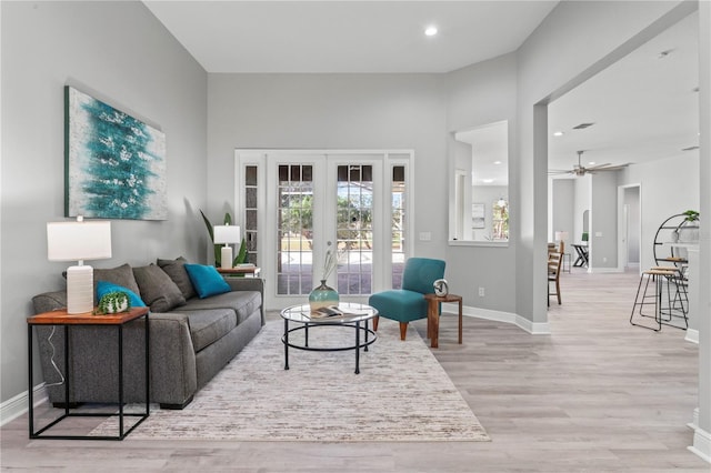 10517 Palm Cove Ave, Tampa, FL 33647 - living area featuring baseboards, a ceiling fan, and light wood finished floors