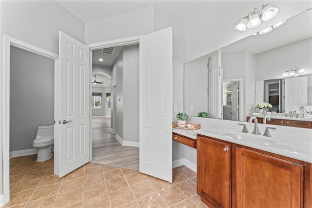 10517 Palm Cove Ave, Tampa, FL 33647 - full bathroom with visible vents, vanity, tile patterned floors, baseboards, and toilet