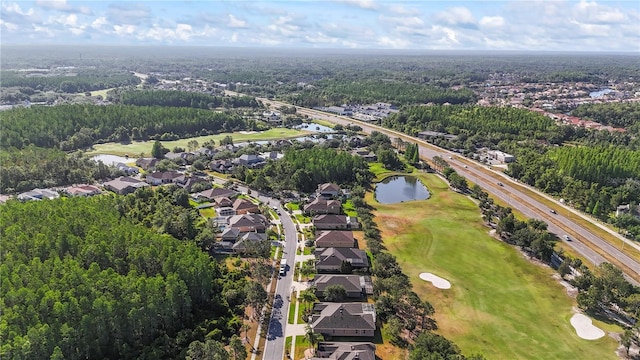 10517 Palm Cove Ave, Tampa, FL 33647 - birds eye view of property featuring a water view, a view of trees, view of golf course, and a residential view