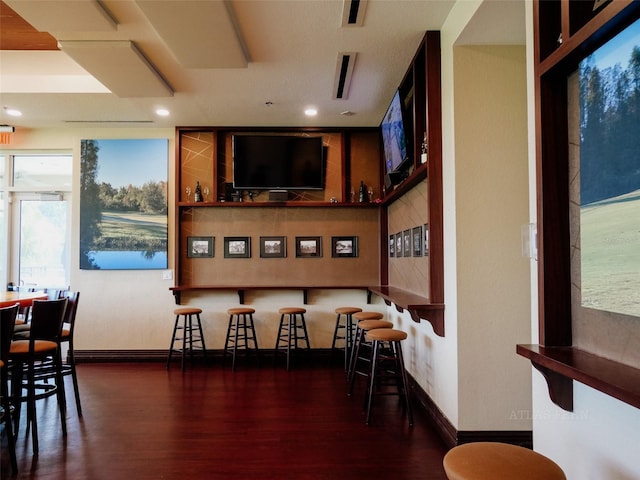 10517 Palm Cove Ave, Tampa, FL 33647 - bar with baseboards, recessed lighting, and wood finished floors