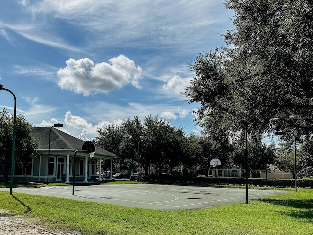 10517 Palm Cove Ave, Tampa, FL 33647 - view of sport court featuring a lawn and community basketball court