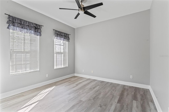 10517 Palm Cove Ave, Tampa, FL 33647 - empty room featuring baseboards, a ceiling fan, and wood finished floors