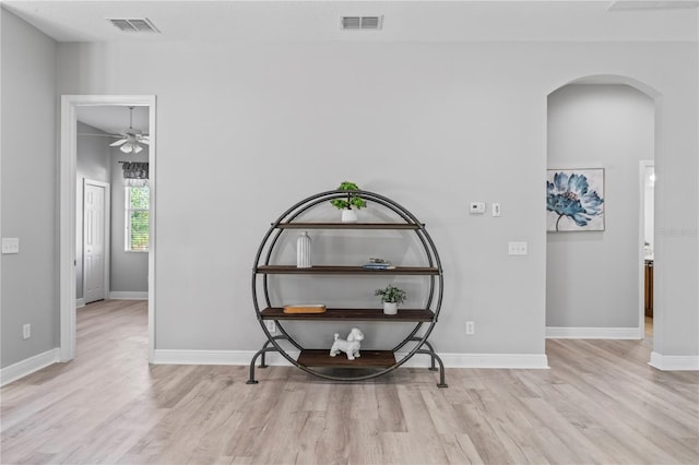 10517 Palm Cove Ave, Tampa, FL 33647 - hall featuring visible vents, arched walkways, and wood finished floors