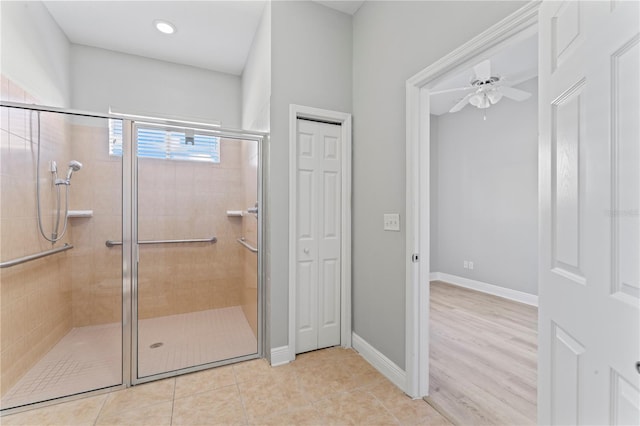 10517 Palm Cove Ave, Tampa, FL 33647 - full bath featuring ceiling fan, baseboards, tile patterned flooring, and a stall shower