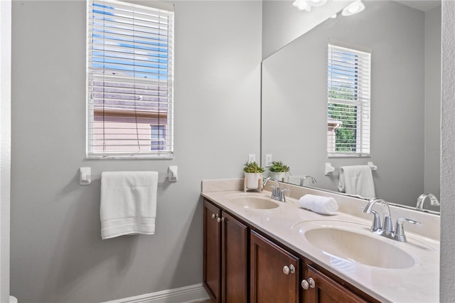 10517 Palm Cove Ave, Tampa, FL 33647 - bathroom featuring a sink and double vanity