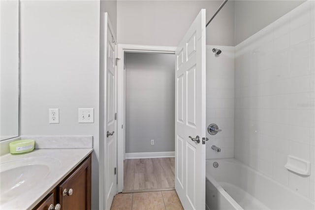 10517 Palm Cove Ave, Tampa, FL 33647 - full bath with baseboards, shower / washtub combination, tile patterned flooring, and vanity